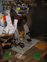 photo of solidarity group members checking the repayments